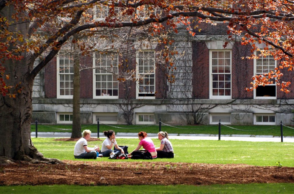 Northampton, 4/30/04, Smith College students sit on the college's green talking in the warm afternoon sun. CUTLINE: 05/09/04 - A quartet of students sits on the green last month talking in the the warm afternoon sun on the Smith College campus in Northampton. CUTLINE: 08/22/04 - Smith college students ist on the college's green talkin in the warm afternoon sun.